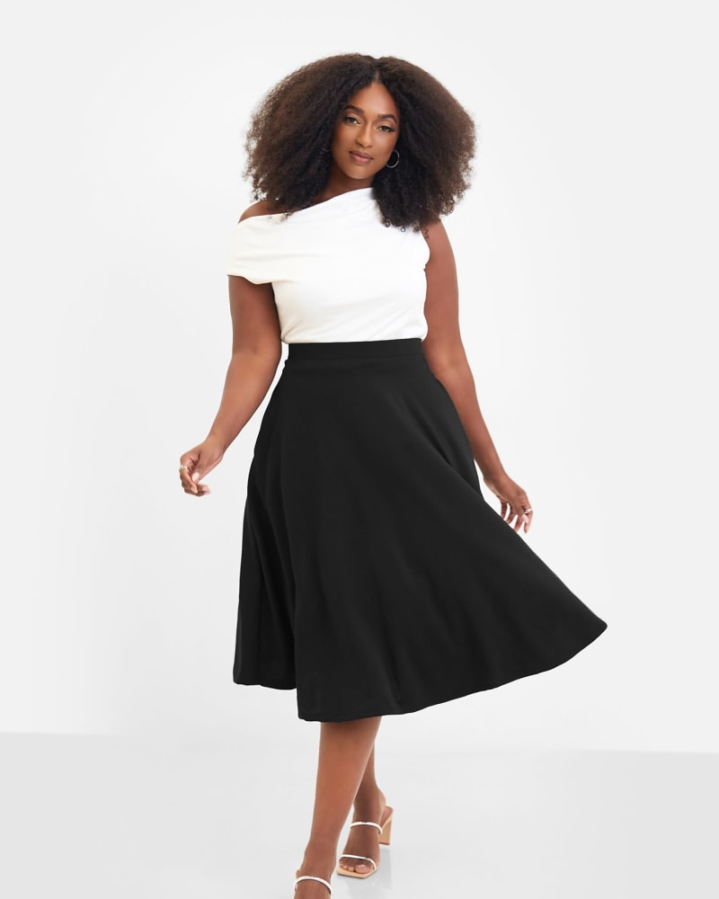 Front of a model wearing a size 1X Essential Crepe Midi Skater Skirt in Black by Rebdolls. | dia_product_style_image_id:321272